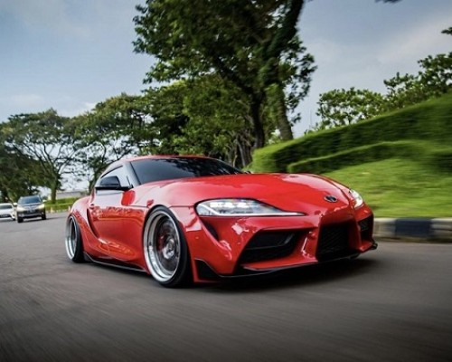 Bright red Toyota supra bagriders pursue difference